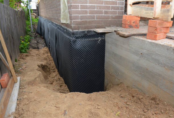 Happy homeowners after waterproofing job in Cutler